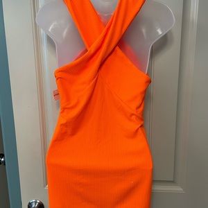 Vibrant orange ribbed halter top.